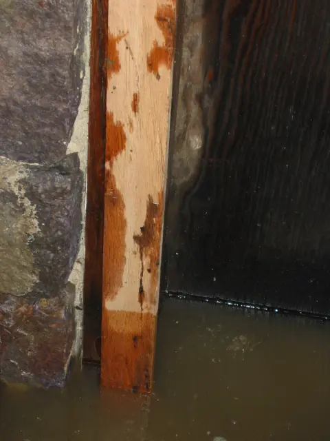 Restored south jamb of DeTurk kitchen doorway in standing water (2009)