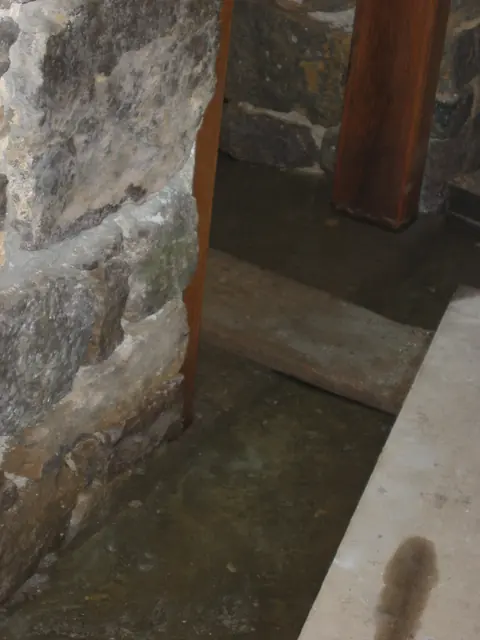 Restored pier foundation and jambs at DeTurk interior passage doorway (2009